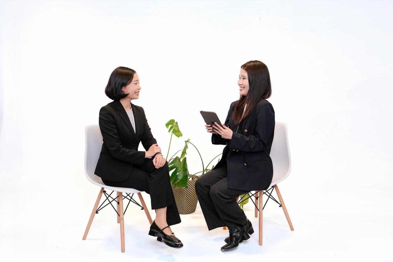 A-Realty advisor consulting a client with a tablet during a professional meeting